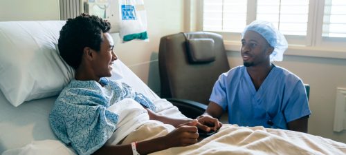 man-in-hospital-bed-16x9-1600x900